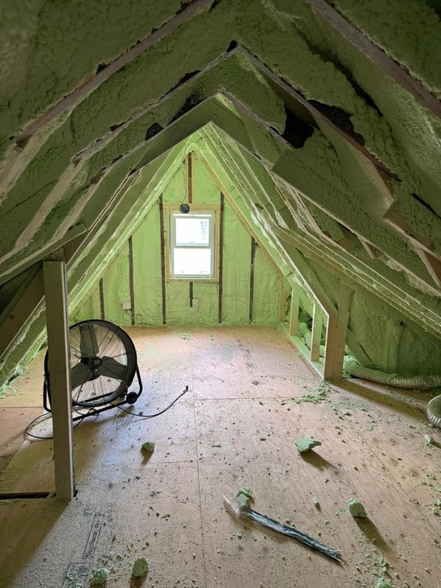 Green spray-applied insulation between attic rafters